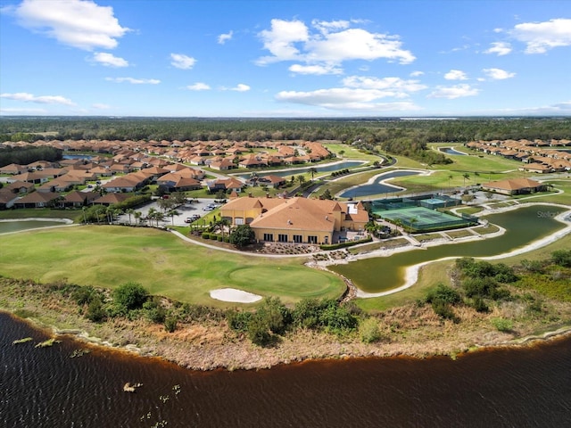 bird's eye view featuring golf course view, a residential view, and a water view