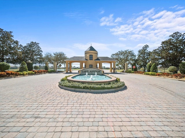 surrounding community featuring curved driveway
