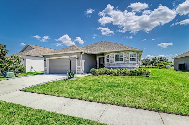 single story home featuring a garage, stone siding, a front yard, stucco siding, and driveway