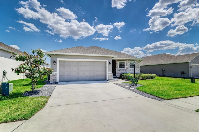 ranch-style home with stone siding, a front yard, stucco siding, an attached garage, and driveway