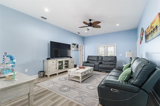 living room with a ceiling fan, visible vents, wood finished floors, and recessed lighting