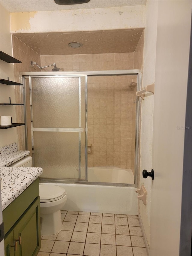 full bath with toilet, tile patterned floors, enclosed tub / shower combo, and vanity