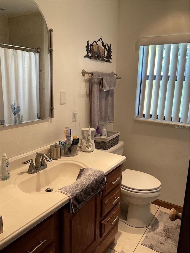 427 Longfellow Blvd, Lakeland, FL 33801 - full bath with vanity, toilet, tile patterned floors, and curtained shower