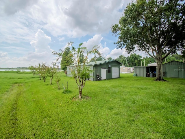 427 Longfellow Blvd, Lakeland, FL 33801 - view of yard with a detached garage and an outbuilding