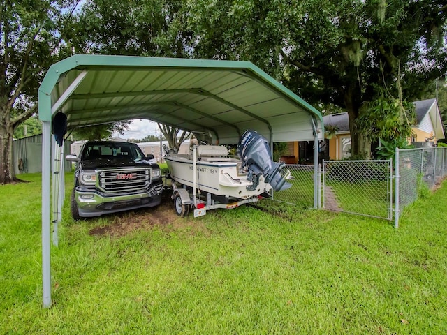 427 Longfellow Blvd, Lakeland, FL 33801 - view of vehicle parking with a detached carport and fence