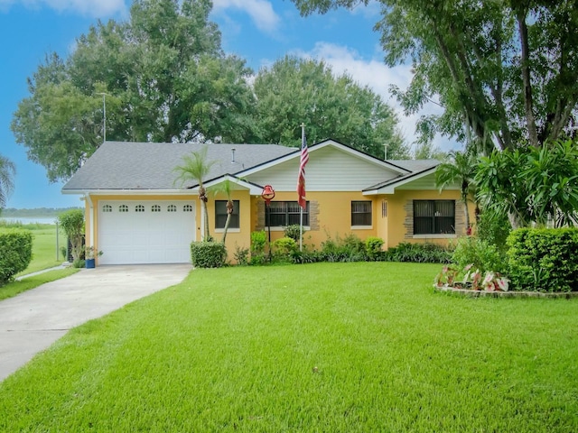 427 Longfellow Blvd, Lakeland, FL 33801 - ranch-style house featuring driveway, a garage, and a front lawn