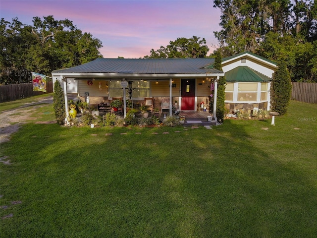 3233 Gardner Rd, Lakeland, FL 33810 - view of front facade with a porch, metal roof, stone siding, and driveway