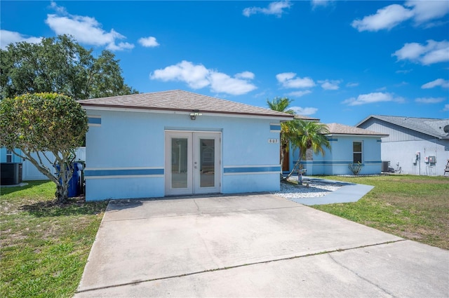 603 Reflections Loop, Winter Haven, FL 33884 - view of front of property featuring french doors, a front yard, and central AC