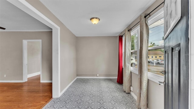 hallway featuring baseboards