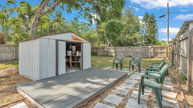 view of shed with a fenced backyard