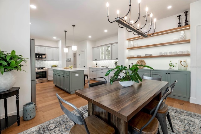 527 W Park St, Lakeland, FL 33803 - dining room featuring light wood-style flooring, a chandelier, and recessed lighting