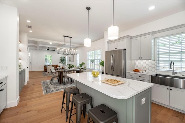 527 W Park St, Lakeland, FL 33803 - kitchen featuring freestanding refrigerator, a sink, light wood-style flooring, ceiling fan, and recessed lighting