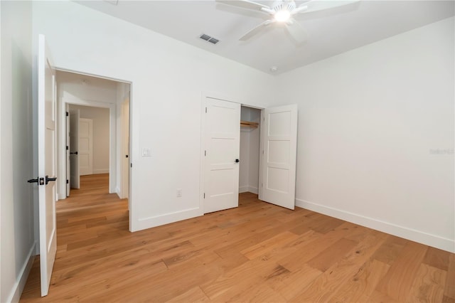 527 W Park St, Lakeland, FL 33803 - unfurnished bedroom with light wood-type flooring, baseboards, a closet, and ceiling fan
