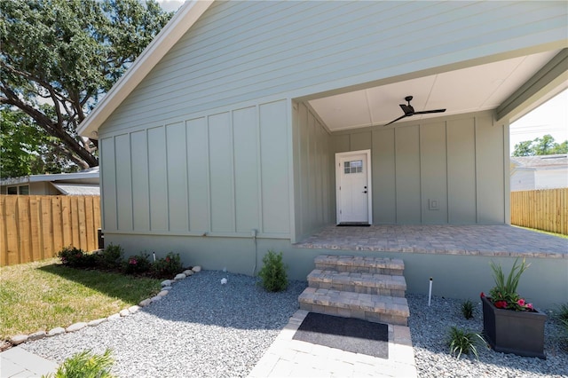 527 W Park St, Lakeland, FL 33803 - view of exterior entry featuring board and batten siding and ceiling fan