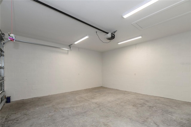 527 W Park St, Lakeland, FL 33803 - garage featuring a garage door opener and concrete block wall
