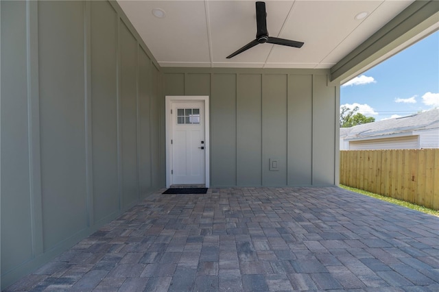 527 W Park St, Lakeland, FL 33803 - view of exterior entry featuring board and batten siding, ceiling fan, and a patio