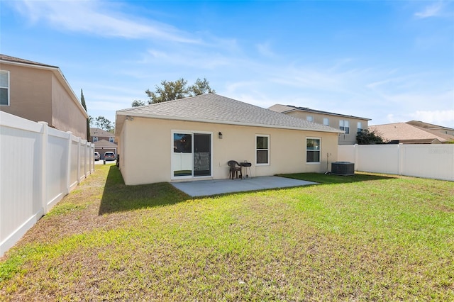 rear view of house featuring a patio, a fenced backyard, stucco siding, and a yard