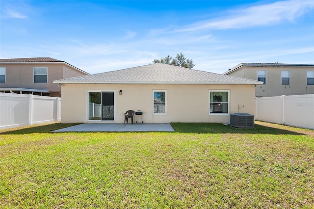 rear view of house featuring a fenced backyard, stucco siding, cooling unit, and a patio area