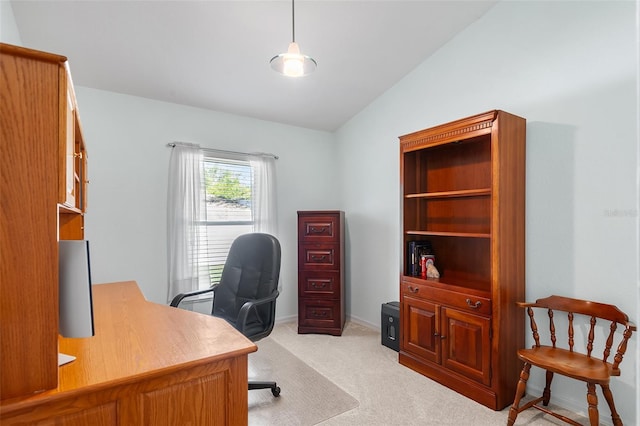 office space with baseboards, light colored carpet, and lofted ceiling