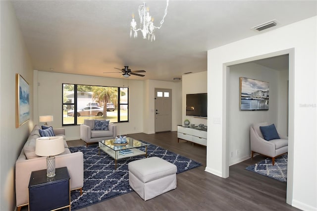 living area featuring visible vents, plenty of natural light, and wood finished floors