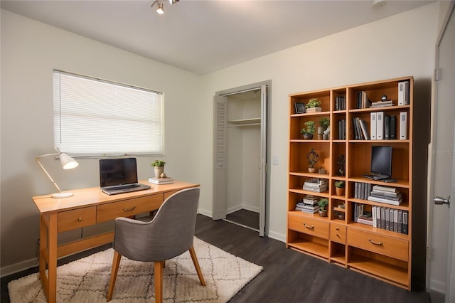 home office with baseboards and dark wood-type flooring