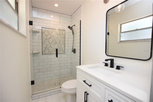 bathroom featuring tile patterned flooring, vanity, toilet, recessed lighting, and a stall shower
