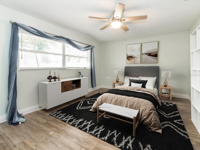 502 Duchess Dr, Lakeland, FL 33803 - bedroom featuring baseboards, ceiling fan, and wood finished floors
