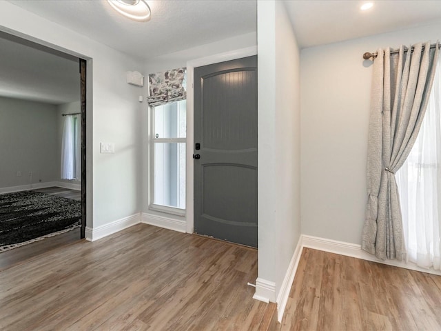 502 Duchess Dr, Lakeland, FL 33803 - foyer entrance with baseboards and wood finished floors