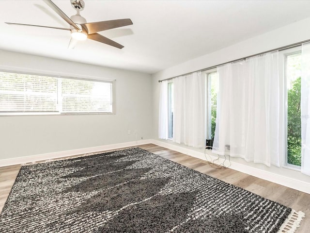 502 Duchess Dr, Lakeland, FL 33803 - empty room with baseboards, ceiling fan, and wood finished floors