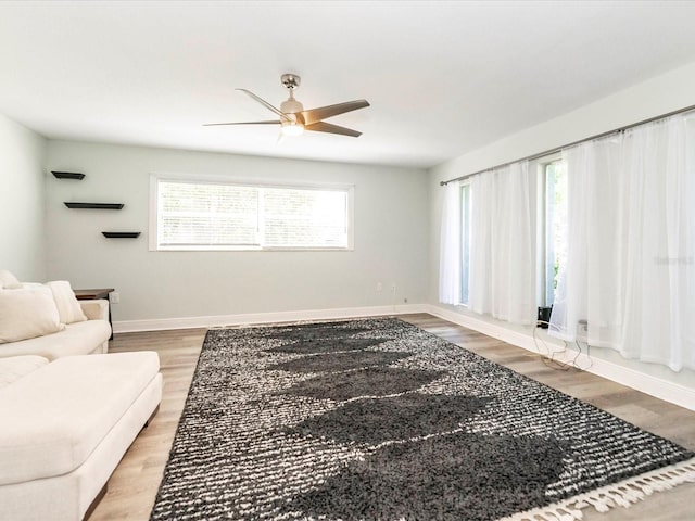 502 Duchess Dr, Lakeland, FL 33803 - living area featuring baseboards, ceiling fan, and wood finished floors