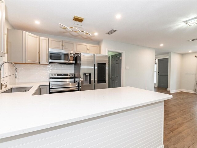 502 Duchess Dr, Lakeland, FL 33803 - kitchen featuring a sink, appliances with stainless steel finishes, visible vents, and light countertops