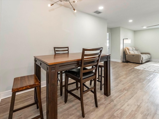 502 Duchess Dr, Lakeland, FL 33803 - dining space featuring visible vents, recessed lighting, light wood-style floors, and baseboards