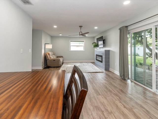 502 Duchess Dr, Lakeland, FL 33803 - living room with recessed lighting, a ceiling fan, visible vents, and a fireplace