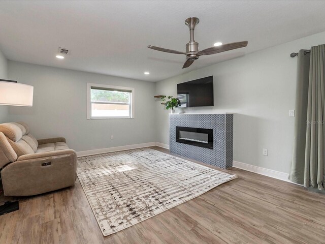502 Duchess Dr, Lakeland, FL 33803 - living room featuring visible vents, baseboards, ceiling fan, and wood finished floors