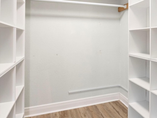 502 Duchess Dr, Lakeland, FL 33803 - walk in closet featuring wood finished floors