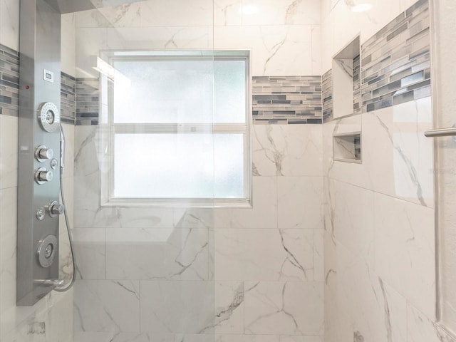 502 Duchess Dr, Lakeland, FL 33803 - full bathroom featuring a marble finish shower