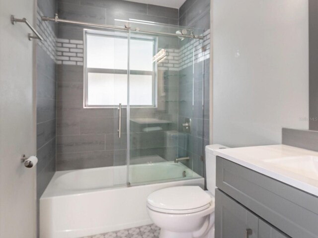 502 Duchess Dr, Lakeland, FL 33803 - full bath with vanity, toilet, and shower / bath combination with glass door