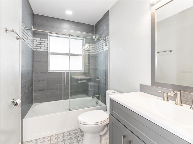 502 Duchess Dr, Lakeland, FL 33803 - bathroom with vanity, enclosed tub / shower combo, tile patterned floors, and toilet