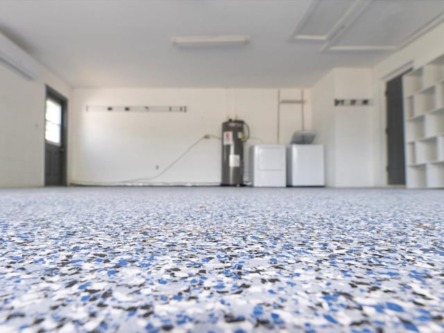 502 Duchess Dr, Lakeland, FL 33803 - garage featuring washing machine and clothes dryer and electric water heater