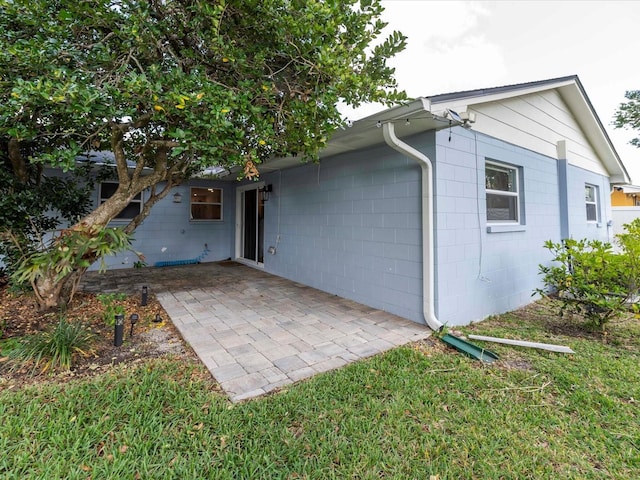 502 Duchess Dr, Lakeland, FL 33803 - back of house with a patio and concrete block siding