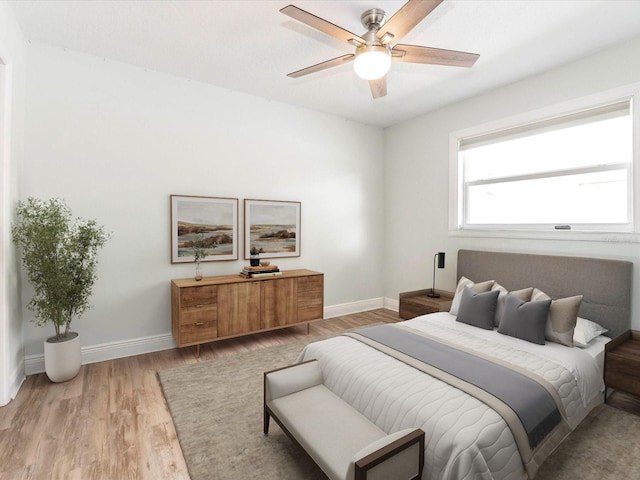 502 Duchess Dr, Lakeland, FL 33803 - bedroom featuring a ceiling fan, baseboards, and light wood-type flooring
