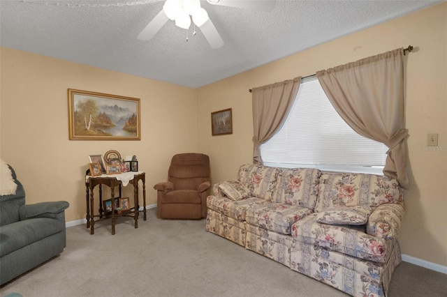 1130 N Lake Parker Ave Unit C321, Lakeland, FL 33805 - carpeted living area featuring baseboards, a textured ceiling, and ceiling fan