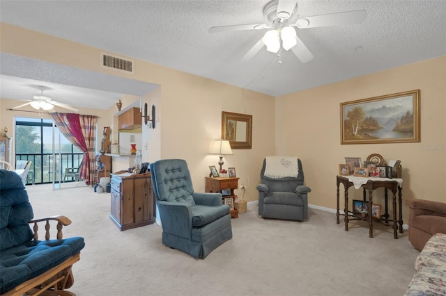 1130 N Lake Parker Ave Unit C321, Lakeland, FL 33805 - living area featuring carpet, a ceiling fan, and a textured ceiling