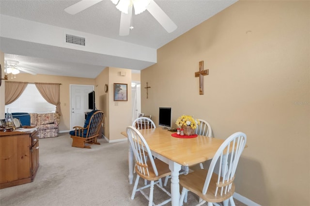 1130 N Lake Parker Ave Unit C321, Lakeland, FL 33805 - dining area featuring visible vents, light carpet, baseboards, ceiling fan, and vaulted ceiling
