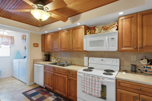 1130 N Lake Parker Ave Unit C321, Lakeland, FL 33805 - kitchen featuring decorative backsplash, independent washer and dryer, a sink, wooden ceiling, and white appliances
