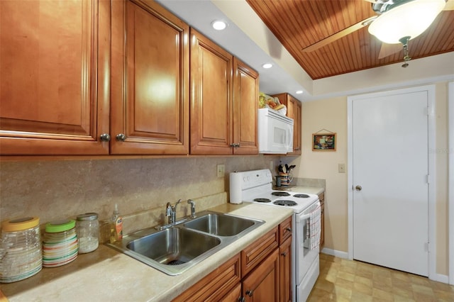 1130 N Lake Parker Ave Unit C321, Lakeland, FL 33805 - kitchen with brown cabinets, a sink, white appliances, light countertops, and wood ceiling