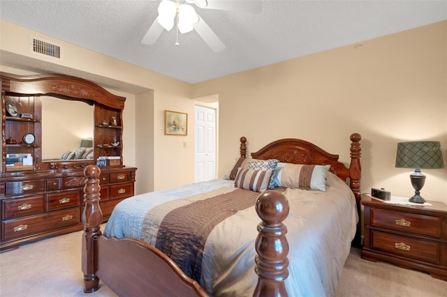 1130 N Lake Parker Ave Unit C321, Lakeland, FL 33805 - bedroom with visible vents, a ceiling fan, carpet, and a textured ceiling