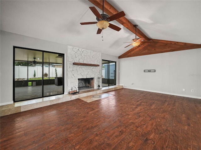 3002 Helms Dr, Auburndale, FL 33823 - unfurnished living room featuring a ceiling fan, a fireplace, wood finished floors, baseboards, and vaulted ceiling with beams