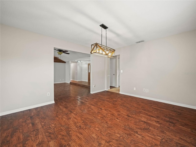 3002 Helms Dr, Auburndale, FL 33823 - spare room with baseboards, ceiling fan, visible vents, and wood finished floors