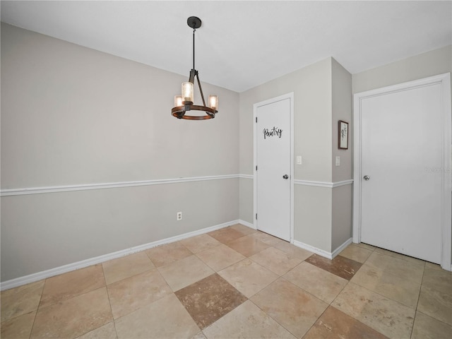 3002 Helms Dr, Auburndale, FL 33823 - unfurnished dining area with an inviting chandelier and baseboards
